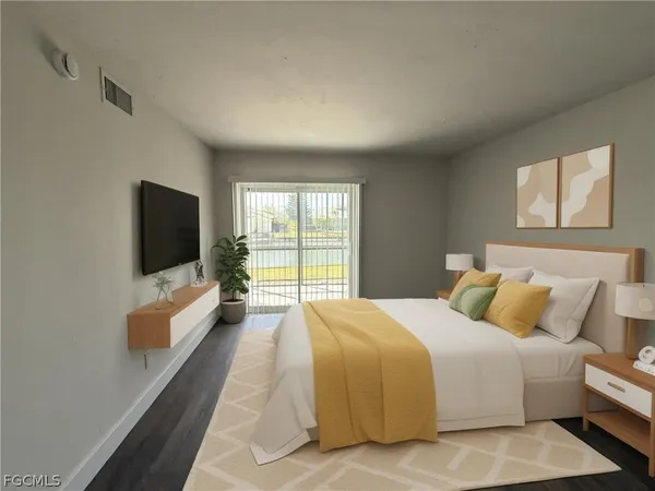 a spacious bedroom with a large bed and a flat screen tv