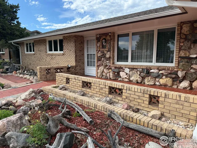 a front view of house with yard outdoor seating and barbeque oven