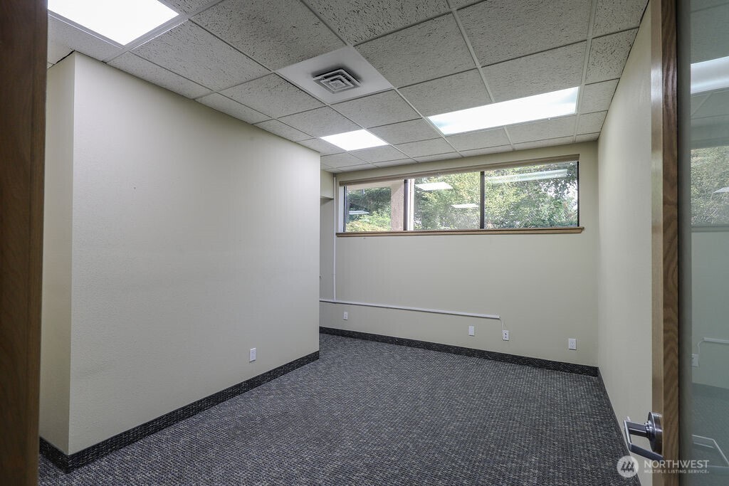 151 South Worthen Street, Unit 1 Wenatchee, WA 98801 - Photo 14 of 27 an empty room with windows