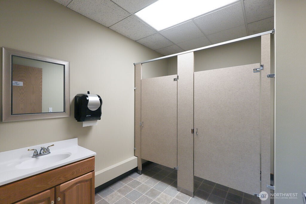 151 South Worthen Street, Unit 1 Wenatchee, WA 98801 - Photo 16 of 27 a bathroom with a sink and a mirror