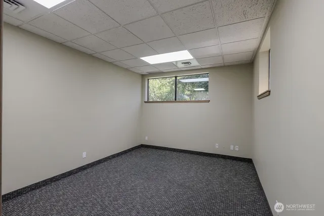 a view of an empty room with a window