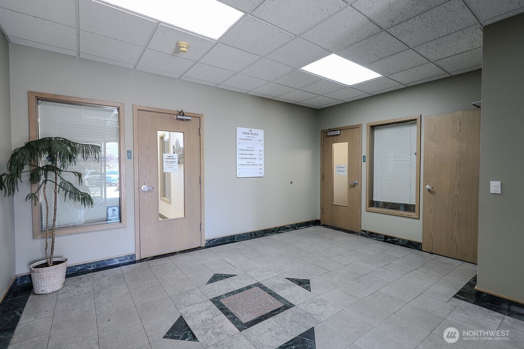 151 South Worthen Street, Unit 1 Wenatchee, WA 98801 - Photo 3 of 27 an empty room with windows