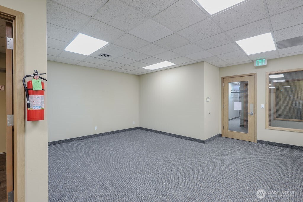 151 South Worthen Street, Unit 1 Wenatchee, WA 98801 - Photo 5 of 27 an empty room with windows