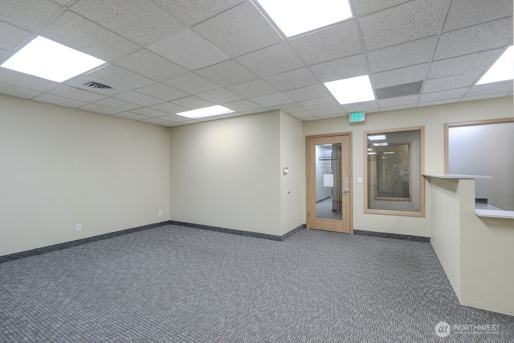 151 South Worthen Street, Unit 1 Wenatchee, WA 98801 - Photo 6 of 27 an empty room with a bathroom and windows