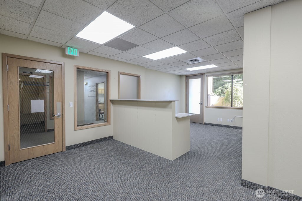 151 South Worthen Street, Unit 1 Wenatchee, WA 98801 - Photo 8 of 27 en empty room with windows and entrance