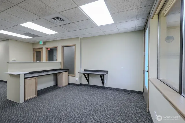 a view of an empty room with a window