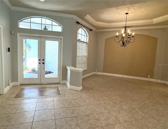 a kitchen with kitchen island granite countertop a sink cabinets and stainless steel appliances