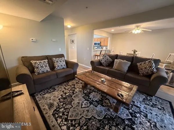 a living room with furniture and a rug
