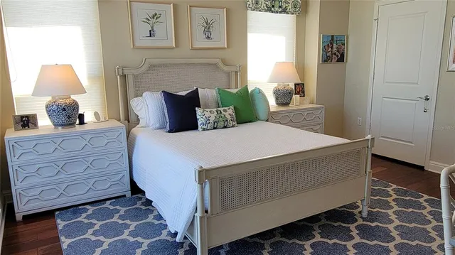 a bed room with a bed and a chair