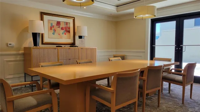 a view of a swimming pool with outdoor seating