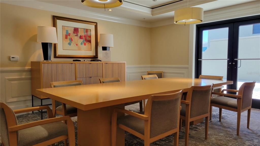 50 Central Avenue, Unit 16A Sarasota, FL 34236 - Photo 26 of 44 a room with table chairs and a dining table