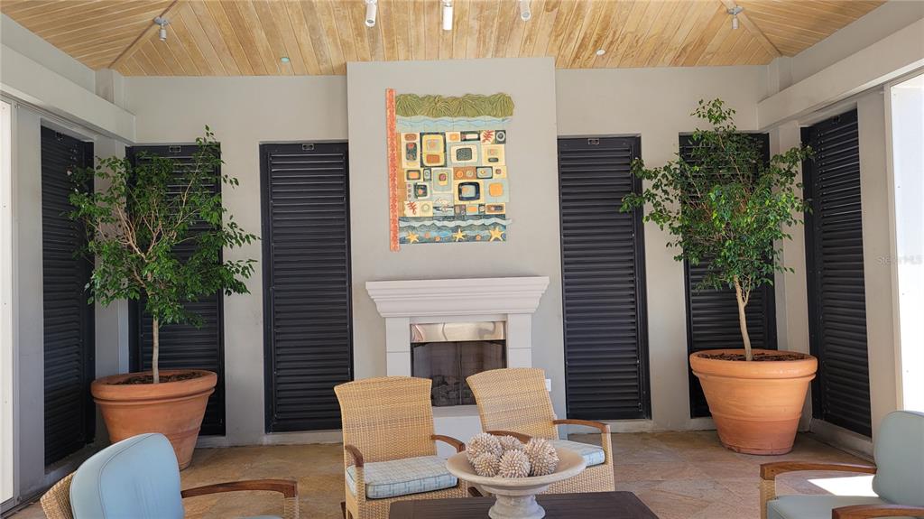 50 Central Avenue, Unit 16A Sarasota, FL 34236 - Photo 30 of 44 a outdoor dining space with furniture and potted plants