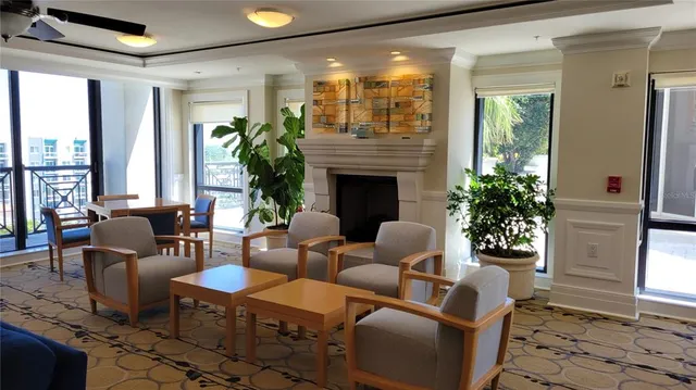a kitchen view with granite countertop a sink and a refrigerator