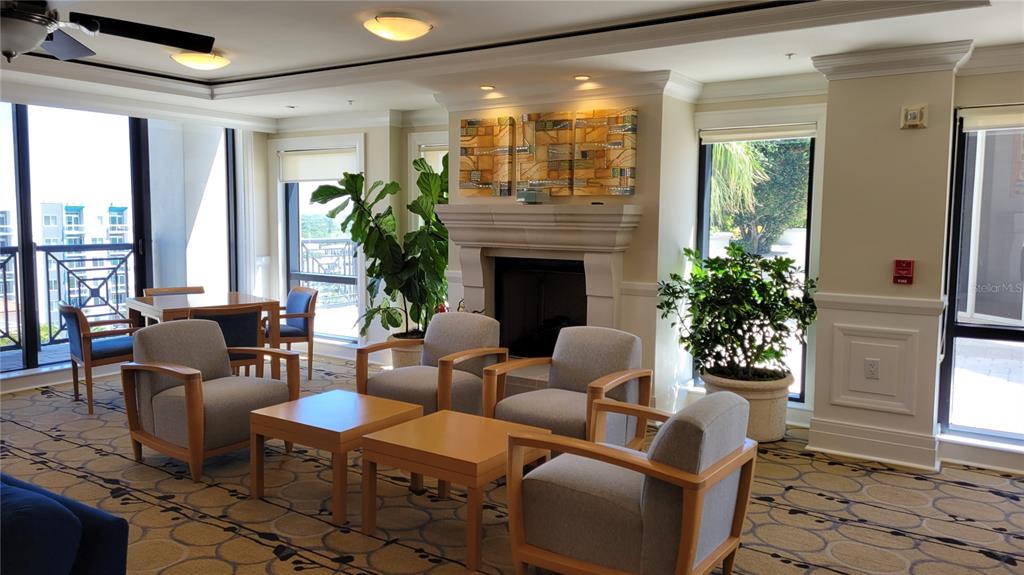 50 Central Avenue, Unit 16A Sarasota, FL 34236 - Photo 31 of 44 a living room with furniture fireplace and a large window