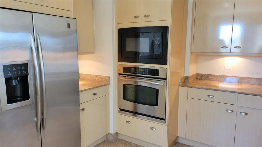 50 Central Avenue, Unit 16A Sarasota, FL 34236 - Photo 34 of 44 a kitchen with cabinets and stainless steel appliances