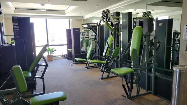 a bedroom with bed and a large mirror