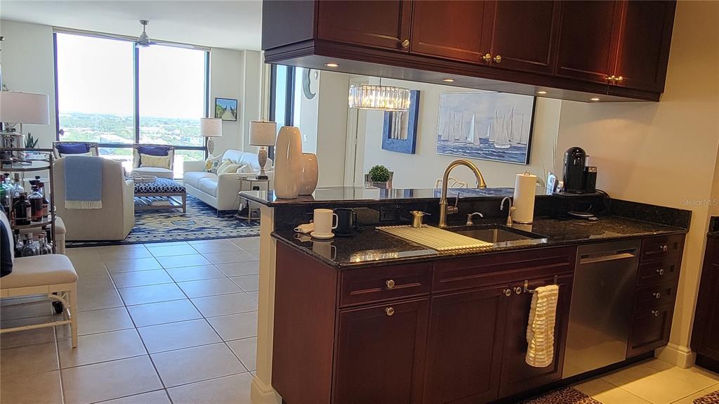 50 Central Avenue, Unit 16A Sarasota, FL 34236 - Photo 6 of 44 a kitchen with a sink and cabinets