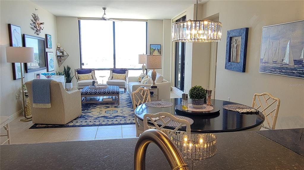 50 Central Avenue, Unit 16A Sarasota, FL 34236 - Photo 9 of 44 a living room with fireplace furniture and a chandelier