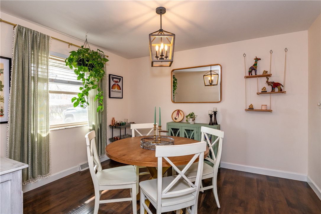 4102 Ridgetop Drive Bellbrook, OH 45305 - Photo 5 of 33 This cozy dining area features rich hardwood flooring and a stylish light fixture.