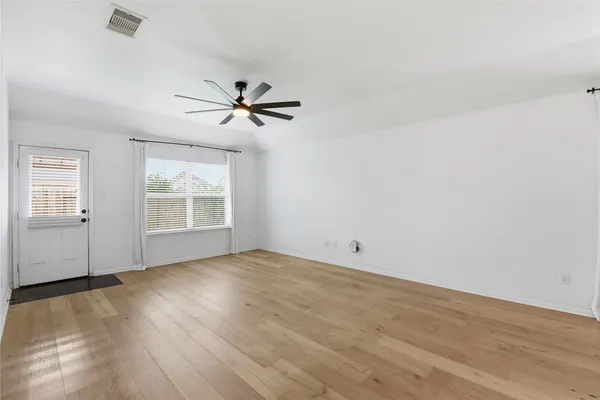 a bathroom with a double vanity sink and mirror