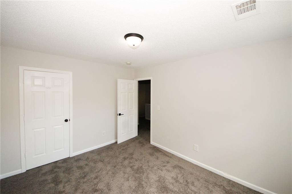 4645 Valais Court, Unit 90 Alpharetta, GA 30022 - Photo 14 of 24 a view of an empty room