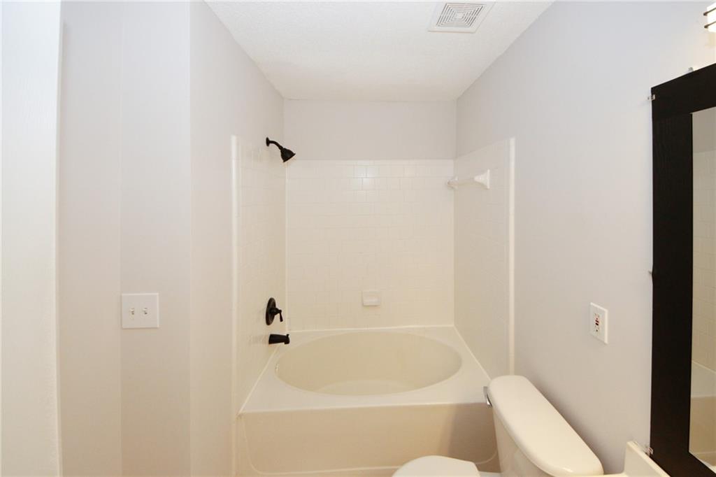 4645 Valais Court, Unit 90 Alpharetta, GA 30022 - Photo 20 of 24 a bathroom with a bathtub
