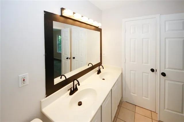 a bathroom with a sink and mirror