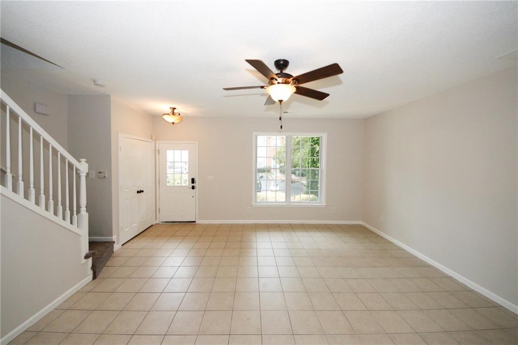 4645 Valais Court, Unit 90 Alpharetta, GA 30022 - Photo 4 of 24 a view of an empty room with a window