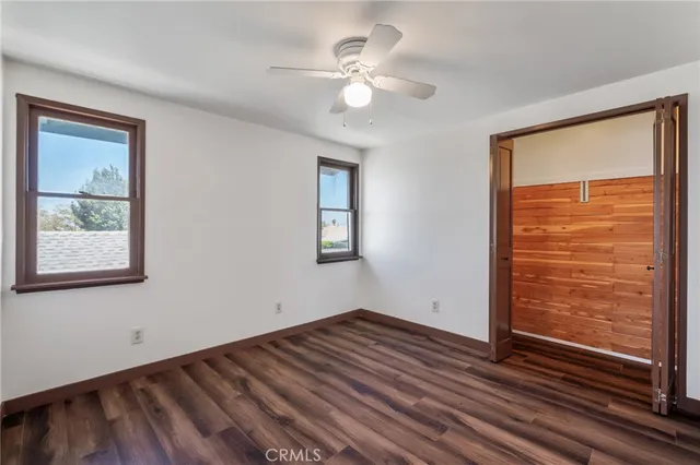 a view of room with window and ceiling fan