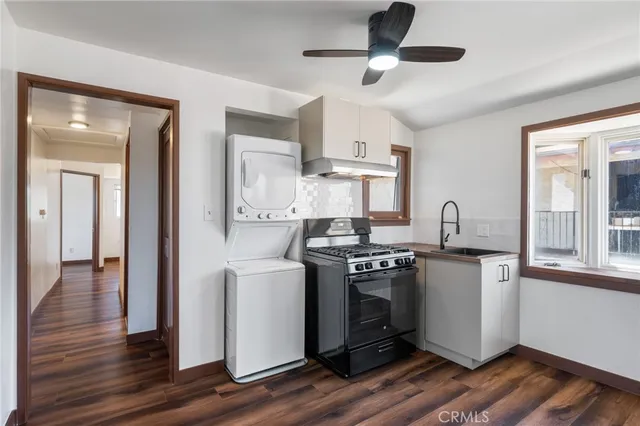 a kitchen with stainless steel appliances granite countertop a stove and a refrigerator