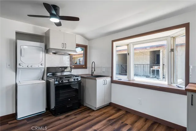 a kitchen with stainless steel appliances granite countertop a stove and a refrigerator