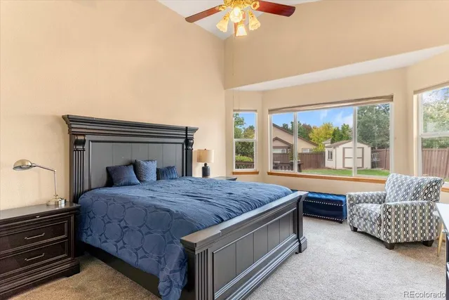 a bedroom with a bed and a couch