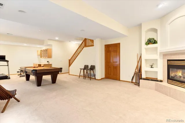 a view of a livingroom with furniture and a fireplace