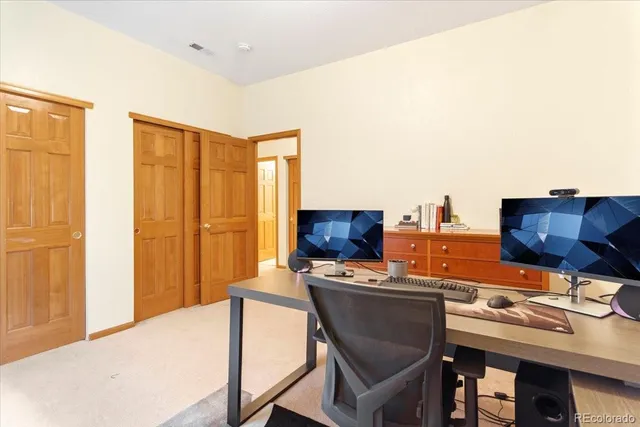 a workspace with furniture and window