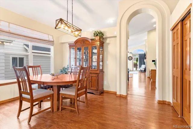 a view of a dining room with furniture window and wooden floor