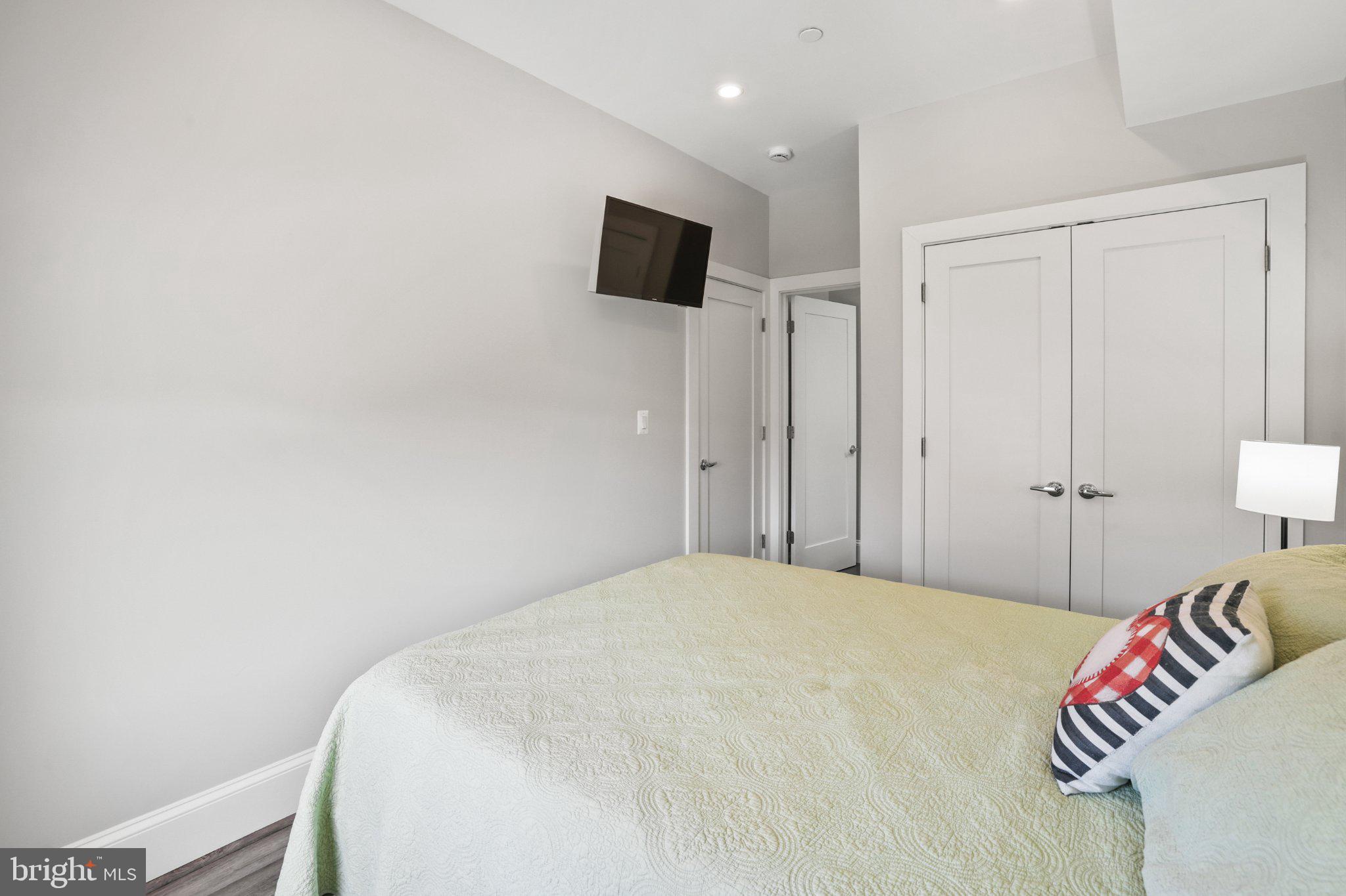 2221 M Street Northeast, Unit PH1 Washington, DC 20002 - Photo 12 of 38 a bedroom with a bed and a tv