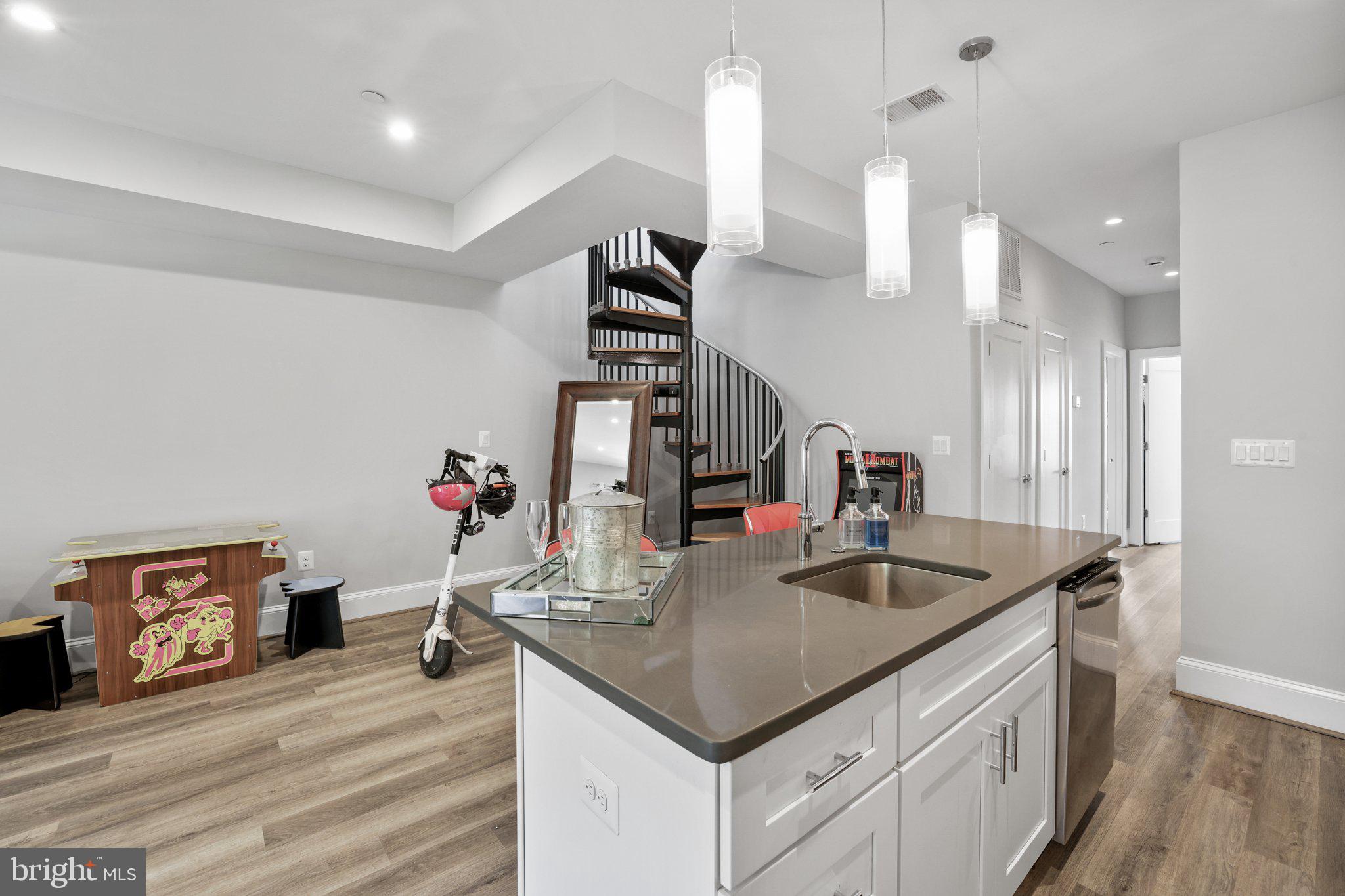 2221 M Street Northeast, Unit PH1 Washington, DC 20002 - Photo 21 of 38 a kitchen with stainless steel appliances granite countertop a sink and a refrigerator