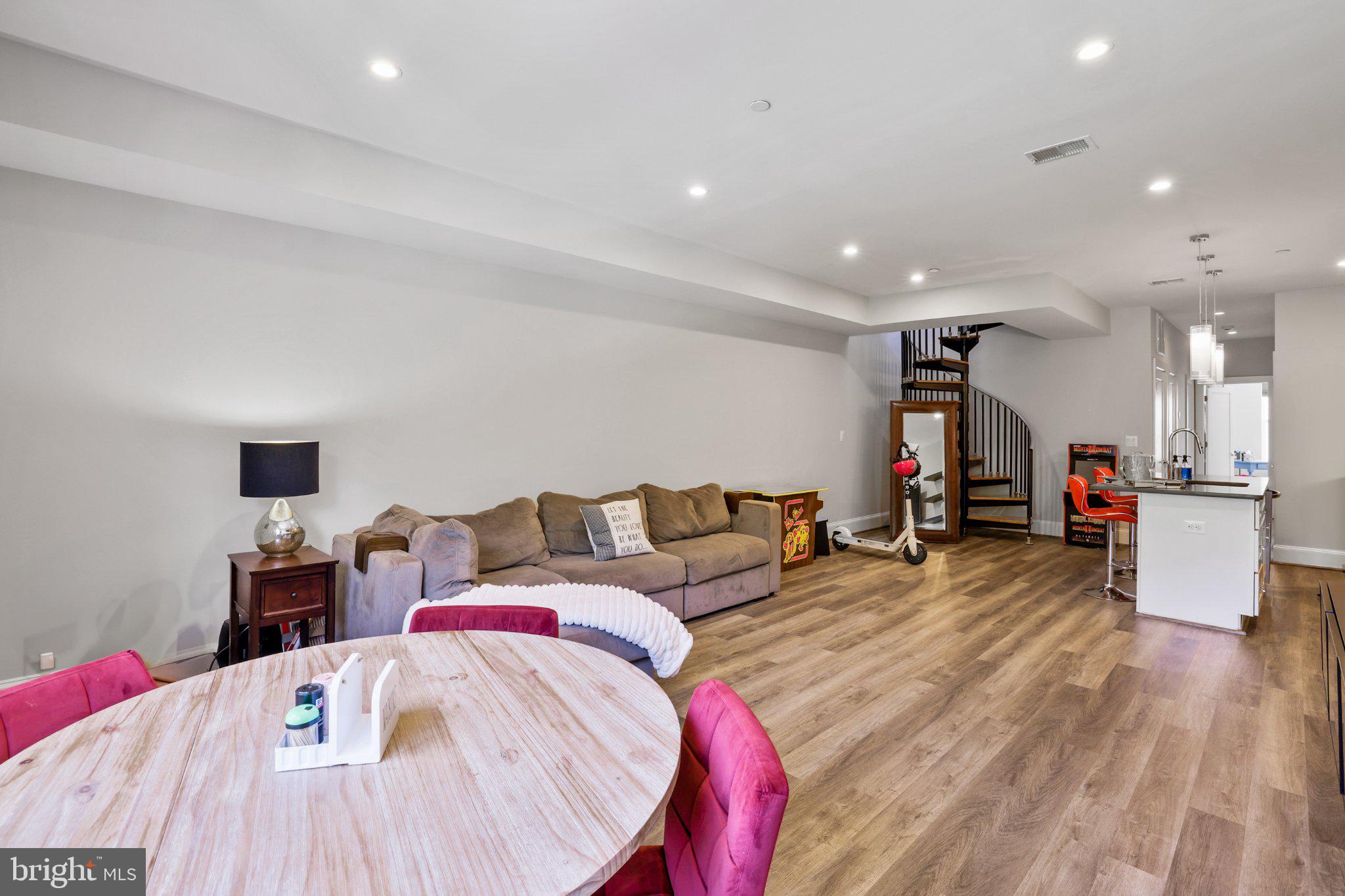 2221 M Street Northeast, Unit PH1 Washington, DC 20002 - Photo 25 of 38 a living room with furniture and a wooden floor