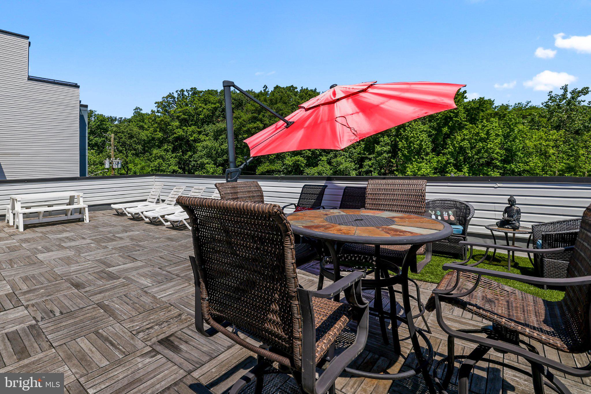 2221 M Street Northeast, Unit PH1 Washington, DC 20002 - Photo 30 of 38 an outdoor sitting area with furniture and wooden deck