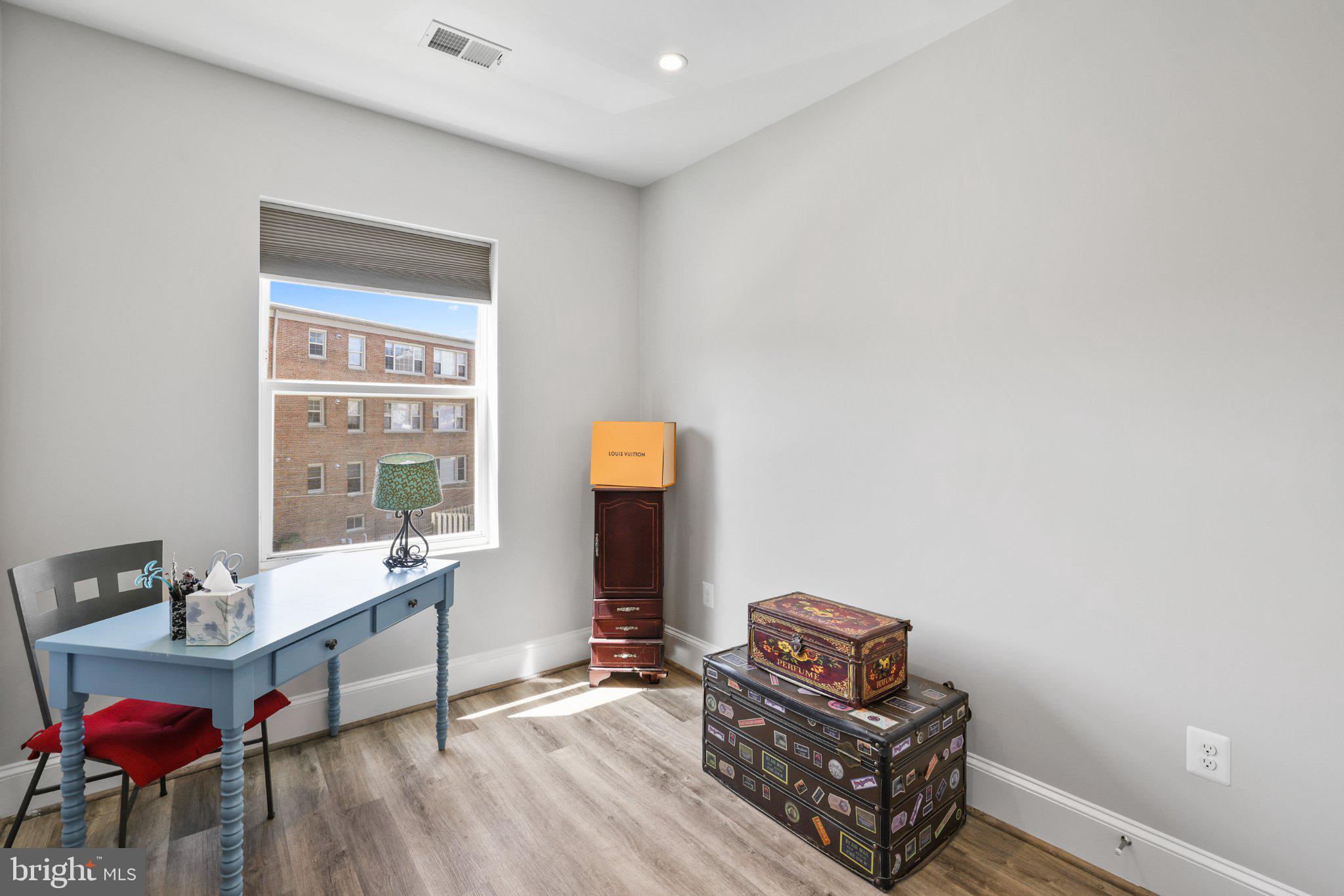 2221 M Street Northeast, Unit PH1 Washington, DC 20002 - Photo 5 of 38 a living room with furniture and a window