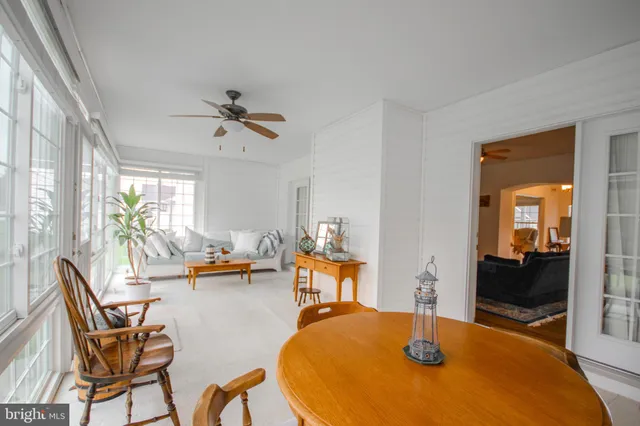 a dining room with a table and chairs