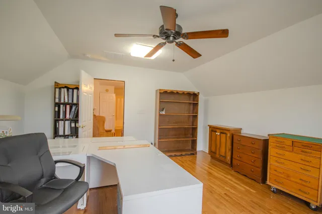 a view of a livingroom with furniture and staircase