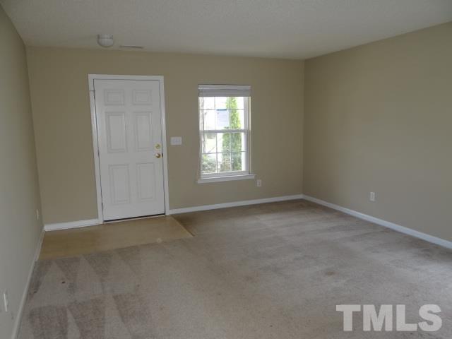 4027 Flat Sedge Lane Raleigh, NC 27604 - Photo 3 of 11 an empty room with a window
