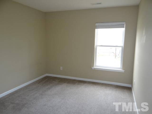 4027 Flat Sedge Lane Raleigh, NC 27604 - Photo 6 of 11 an empty room with a window