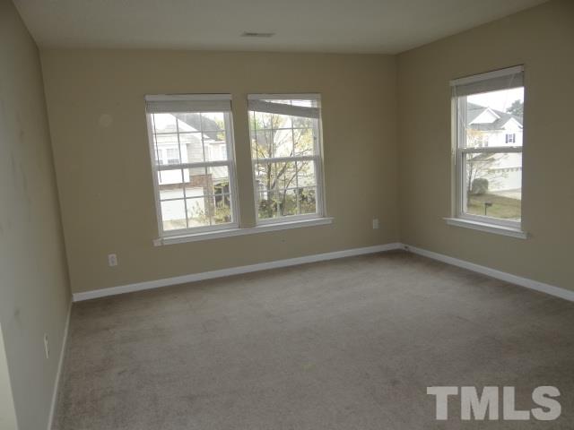 4027 Flat Sedge Lane Raleigh, NC 27604 - Photo 9 of 11 an empty room with a window