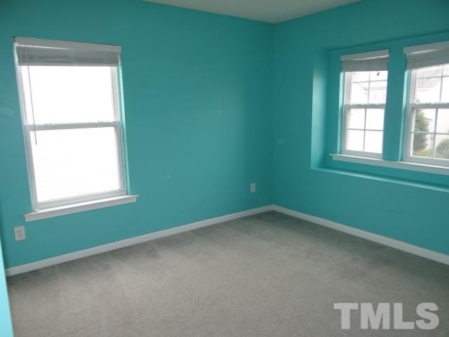 4027 Flat Sedge Lane Raleigh, NC 27604 - Photo 10 of 11 an empty room with a window