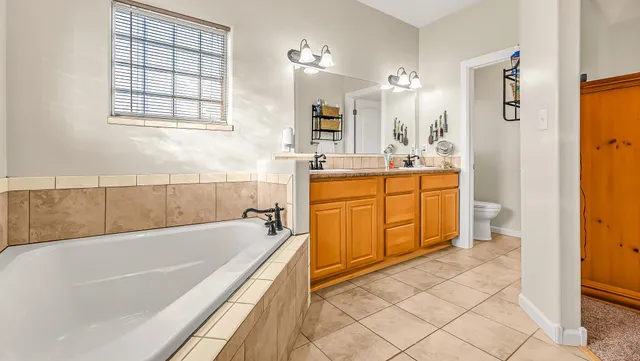 a bathroom with a sink and a large mirror