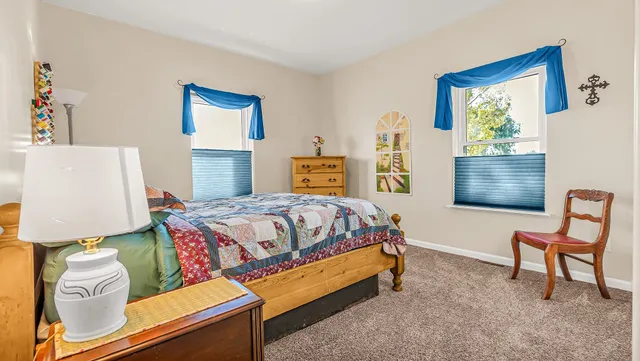 a view of a swimming pool and outdoor seating