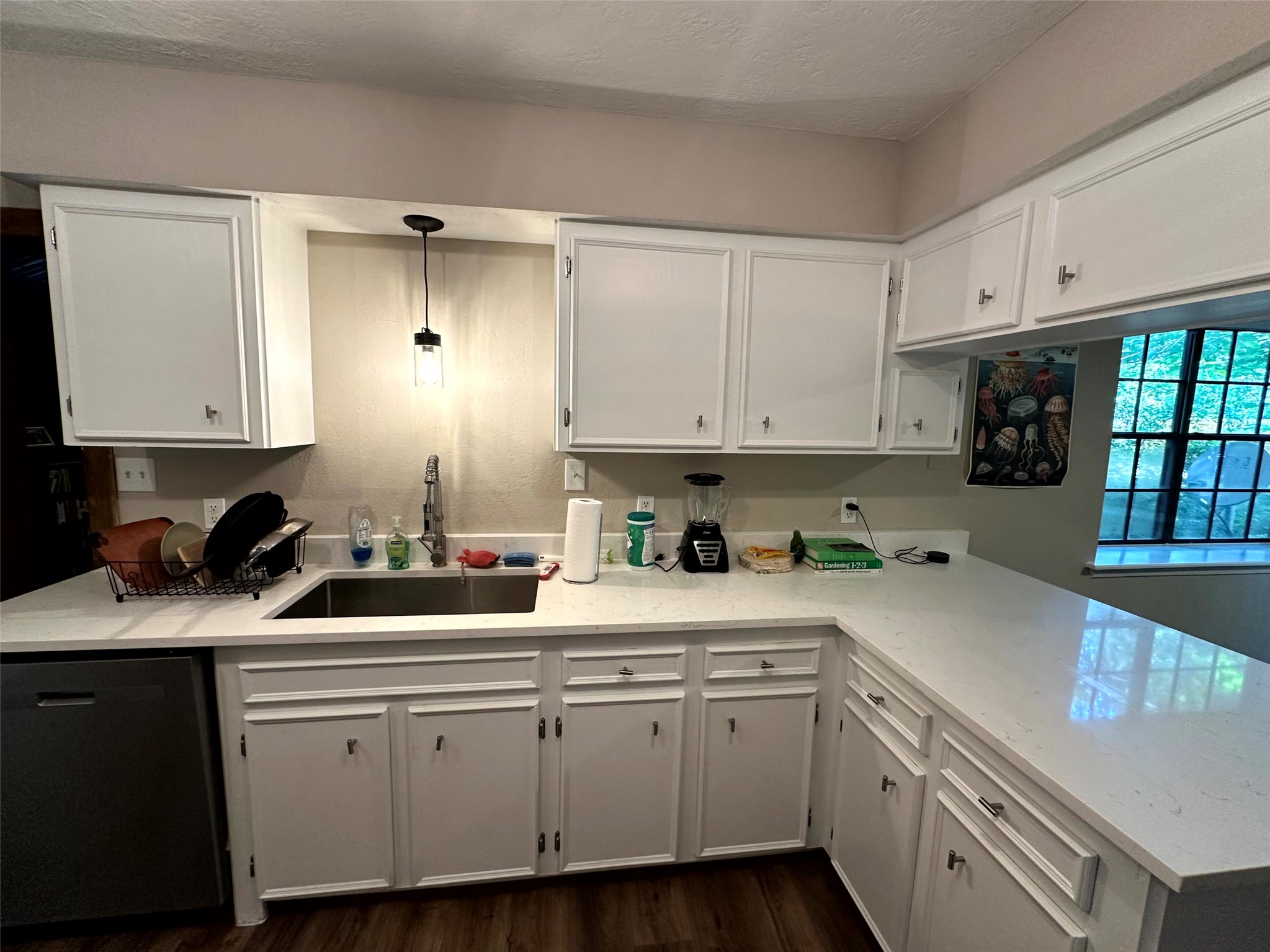12289 Thompson Road Willis, TX 77318 - Photo 7 of 20 Kitchen complete with single basin sink and quartz countertops.
