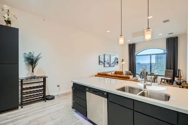 a kitchen with a sink and a stove